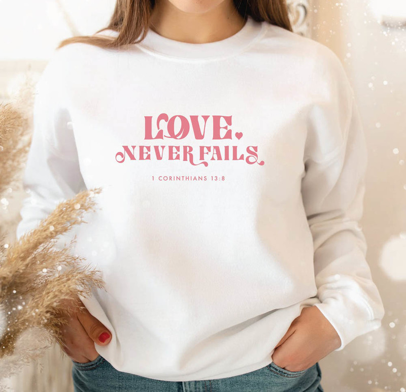 Love Never Fails Christian Verse Sweatshirt